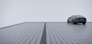 En fotorealistisk bild av en modern uppfart med granitstenar och en enkel, elegant design.